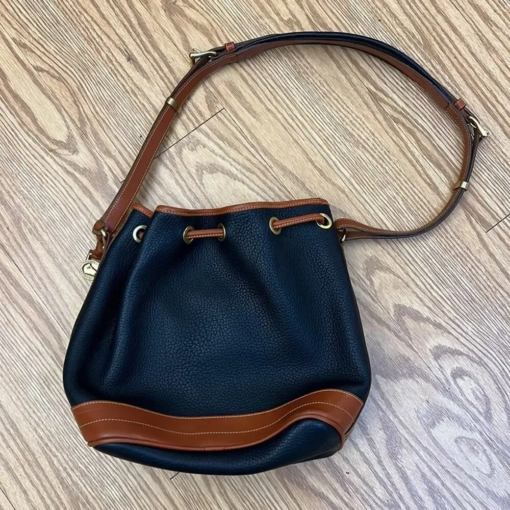 Dooney & Bourke tassel bucket bag blue pebbled leather tan accent gold hardware